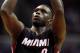 Miami Heat forward Luol Deng (9) shoots a free throw in the first half of an NBA basketball game against the Washington Wizards, Monday, Dec. 1, 2014, in Washington. (AP Photo/Alex Brandon)