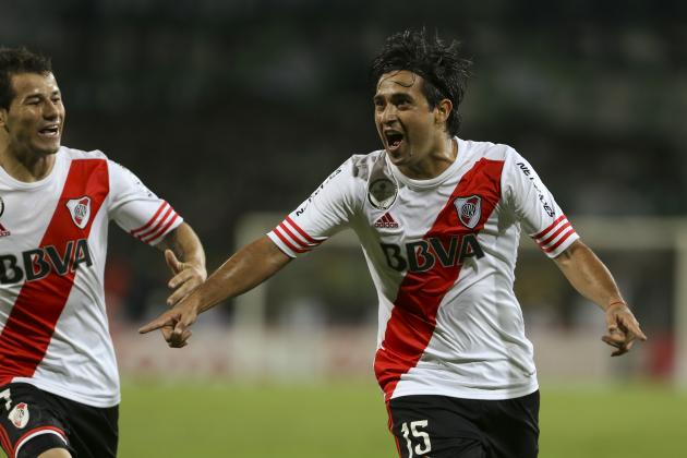 Leonardo Pisculichi, of Argentina's River Plate, celebrates scoring against Colombia's Atletico Nacional during the Copa Sudamericana first leg final soccer match, in Medellin, Colombia, Wednesday, Dec. 3, 2014. (AP Photo/Fernando Vergara)