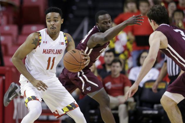 Maryland's Jared Nickens, left, drives around Fordham guards Bryan Smith, back center, and Nemanja Zarkovic during the second half of an NCAA college basketball game, Thursday, Nov. 20, 2014, in College Park, Md. Maryland won 66-50. (AP Photo/Patrick Semansky)