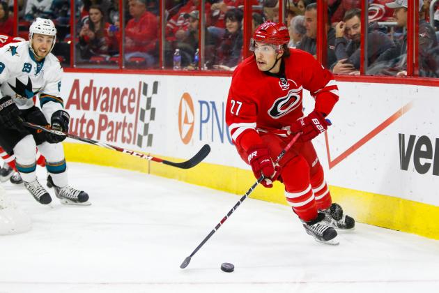 Nov 16, 2014; Raleigh, NC, USA; Carolina Hurricanes defensemen Justin Faulk (27) skates with the puck against the San Jose Sharks at PNC Arena. The San Jose Sharks  defeated the Carolina Hurricanes 2-0. Mandatory Credit: James Guillory-USA TODAY Sports