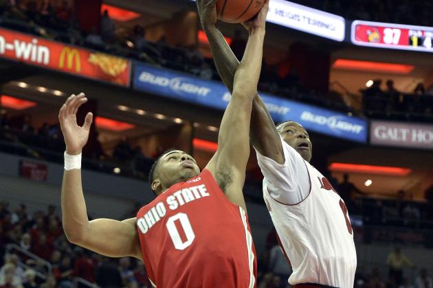 Louisville's Terry Rozier, right, battles Ohio State's D'Angelo Russell for a rebound during the second half of an NCAA college basketball game Tuesday, Dec. 2, 2014, in Louisville, Ky. Louisville won 64-55. (AP Photo/Timothy D. Easley)