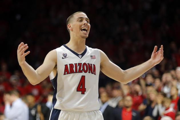Arizona guard T.J. McConnell (4) celebrates after defeating Gonzaga 66-63 in overtime during an NCAA college basketball game, Saturday, Dec. 6, 2014, in Tucson, Ariz. (AP Photo/Rick Scuteri)