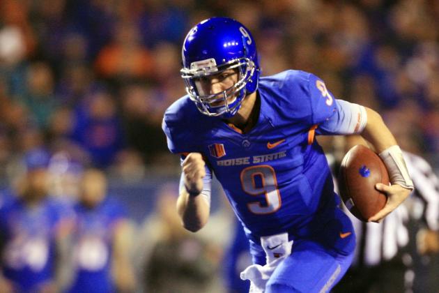 Dec 6, 2014; Boise, ID, USA; Boise State Broncos quarterback Grant Hedrick (9) scores a touchdown during the first half verses the Fresno State Bulldogs at Albertsons Stadium. Mandatory Credit: Brian Losness-USA TODAY Sports