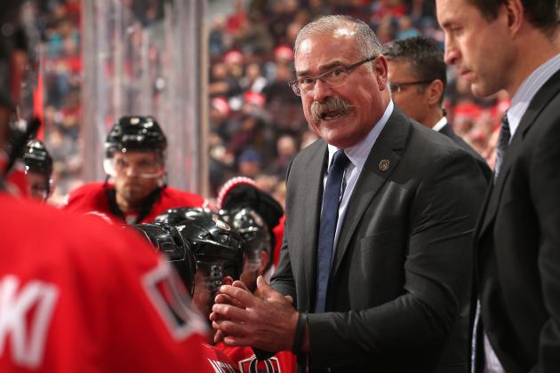 OTTAWA, ON - OCTOBER 18: Head coach Paul MacLean of the Ottawa Senators talks to his players during a second period timeout in an NHL game against the Columbus Blue Jackets at Canadian Tire Centre on October 18, 2014 in Ottawa, Ontario, Canada.  (Photo by Andre Ringuette/NHLI via Getty Images)