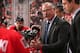 OTTAWA, ON - OCTOBER 18: Head coach Paul MacLean of the Ottawa Senators talks to his players during a second period timeout in an NHL game against the Columbus Blue Jackets at Canadian Tire Centre on October 18, 2014 in Ottawa, Ontario, Canada. (Photo by Andre Ringuette/NHLI via Getty Images)