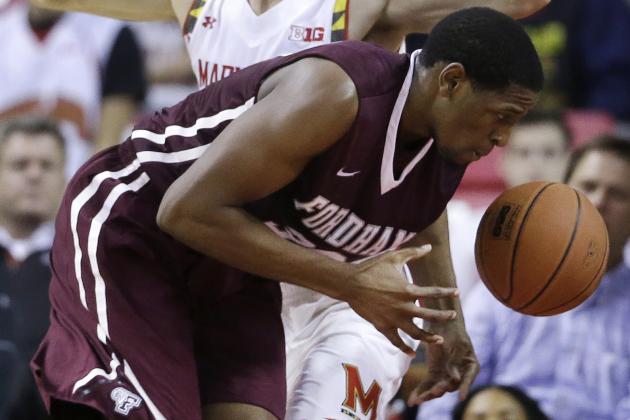 Fordham forward Ryan Rhoomes, front, tries to maintain possession as he collides with Maryland's Jake Layman while driving to the basket during the second half of an NCAA college basketball game, Thursday, Nov. 20, 2014, in College Park, Md. Maryland won 66-50. (AP Photo/Patrick Semansky)