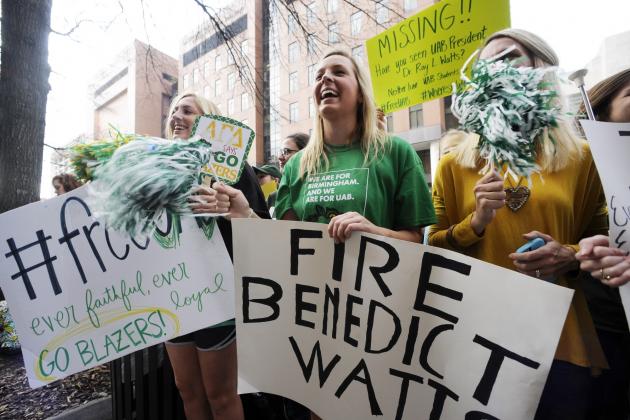 UAB student Mallory Sisk, center, chants with other demonstrators protesting the possible shutdown of the football program at the University of Alabama at Birmingham on Tuesday, Dec. 2, 2014, in Birmingham, Ala. Several hundred students, athletes and fans marched to the administration building on the third straight day of protests on campus. (AP Photo/Jay Reeves)