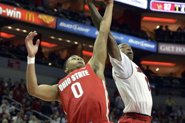 Louisville's Terry Rozier, right, battles Ohio State's D'Angelo Russell for a rebound during the second half of an NCAA college basketball game Tuesday, Dec. 2, 2014, in Louisville, Ky. Louisville won 64-55. (AP Photo/Timothy D. Easley)