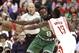 Boston Celtics' Jeff Green (8) keeps the ball just out of the reach of Houston Rockets' James Harden's during the first half of an NBA basketball game Saturday, Nov. 1, 2014, in Houston. (AP Photo/Pat Sullivan)