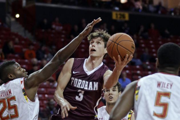 Fordham guard Nemanja Zarkovic, center, shoots over Maryland forward Jon Graham (25), guard Dion Wiley (5) and forward Michal Cekovsky, back, of Slovakia, during the first half of an NCAA college basketball game, Thursday, Nov. 20, 2014, in College Park, Md. (AP Photo/Patrick Semansky)