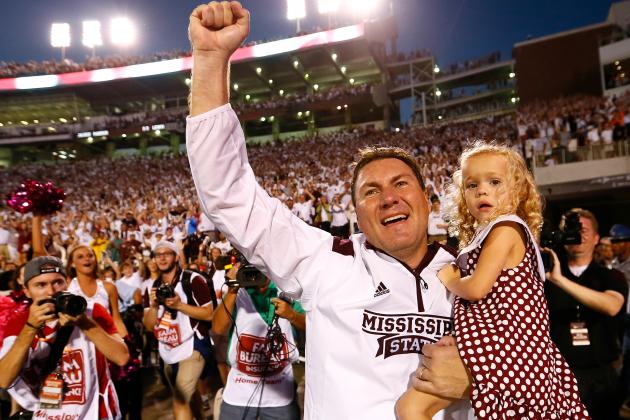 STARKVILLE, MS - OCTOBER 11:  Head coach Dan Mullen of the Mississippi State Bulldogs celebrates their 38-23 win over the Auburn Tigers with daughter Breelyn at Davis Wade Stadium on October 11, 2014 in Starkville, Mississippi.  (Photo by Kevin C. Cox/Getty Images)