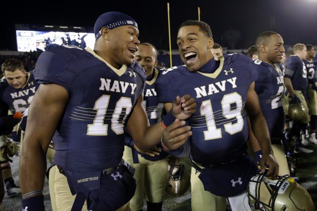 Navy quarterback Keenan Reynolds, right, celebrates with teammate John Hendrick after an NCAA college football game against Georgia Southern, Saturday, Nov. 15, 2014, in Annapolis, Md. Reynolds ran for six touchdowns to lead Navy over Georgia Southern 52-19. (AP Photo/Patrick Semansky)