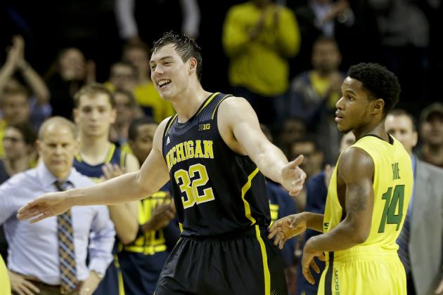 Michigan's Ricky Doyle (32) and Oregon's Ahmaad Rorie (14) react during the second half of an NCAA college basketball game Tuesday, Nov. 25, 2014, in New York. Michigan won the game 70-63. (AP Photo/Frank Franklin II)