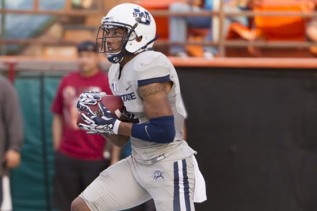 Utah State wide receiver Hunter Sharp (4) catches the football from a Hawaii kickoff in the first quarter of an NCAA college football game, Saturday, Nov. 1, 2014, in Honolulu. (AP Photo/Eugene Tanner)