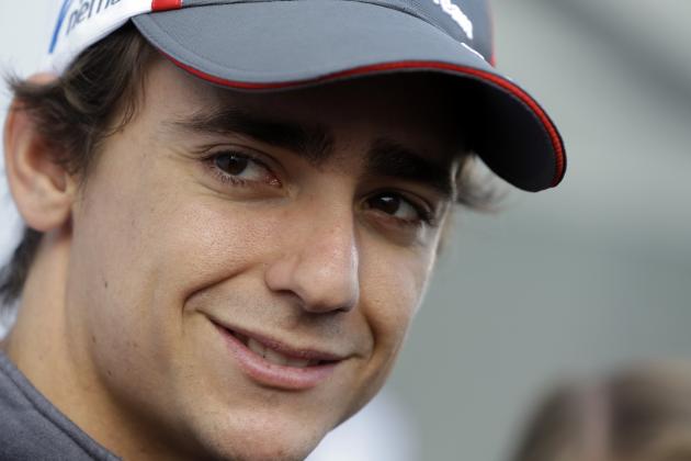 Sauber driver Esteban Gutierrez of Mexico smiles as he answers to reporters in the paddock at the Spa-Francorchamps circuit, Belgium, Thursday, Aug. 21, 2014. The Belgium Formula One Grand Prix will be held on Sunday. (AP Photo/Luca Bruno)