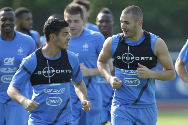 French national soccer forwards players, Hatem Ben Arfa, left, and Karim Benzema, right, chat during a training session in Clairefontaine near Paris, Thursday, May 24, 2012. France will play Iceland on Sunday. (AP Photo/Thibault Camus)