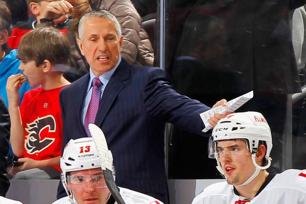 NEWARK, NJ - APRIL 07: Head coach Bob Hartley of the Calgary Flames gives instructions against the New Jersey Devils during the game at the Prudential Center on April 7, 2014 in Newark, New Jersey.  (Photo by Andy Marlin/NHLI via Getty Images)