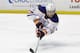 Edmonton Oilers' Taylor Hall dives for the puck during the third period of an NHL hockey game against the Anaheim Ducks, Wednesday, Dec. 10, 2014, in Anaheim, Calif. The Ducks won 2-1. (AP Photo/Jae C. Hong)