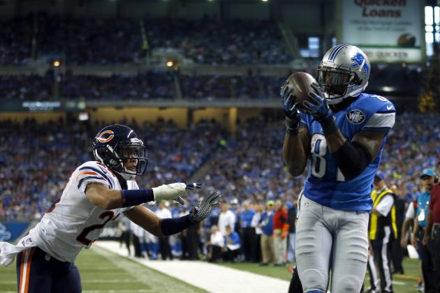 Detroit Lions wide receiver Calvin Johnson (81) catches a touchdown in front of Chicago Bears cornerback Kyle Fuller (23) during an NFL football game on Thursday, Nov. 27, 2014 in Detroit. The Lions won the game 34-17. (Jeff Haynes/AP Images for Panini)