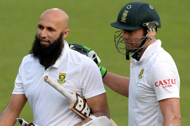 PRETORIA, SOUTH AFRICA - DECEMBER 17: (SOUTH AFRICA OUT)  Hashim Amla and AB de Villiers walk off after their record 4th wicket partnership during day 1 of the 1st Test match between South Africa and West Indies at SuperSport Park on December 17, 2014 in Pretoria, South Africa. (Photo by Duif du Toit/Gallo Images/Getty Images)