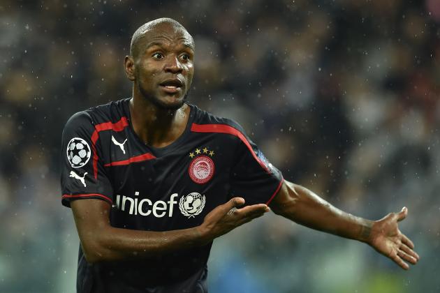 TURIN, ITALY - NOVEMBER 04: Eric Abidal of Olympiacos FC reacts during the UEFA Champions League group A match between Juventus and Olympiacos FC at Juventus Arena on November 4, 2014 in Turin, Italy. (Photo by Valerio Pennicino/Getty Images)