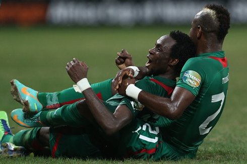 Burkina Faso's Jonathan Pitroipa, top, with teammate celebrates his goal during their African Cup of Nations quarter final soccer match against Togo at Mbombela Stadium in Nelspruit, South Africa, Sunday Feb. 3, 2013. (AP Photo/Themba Hadebe)