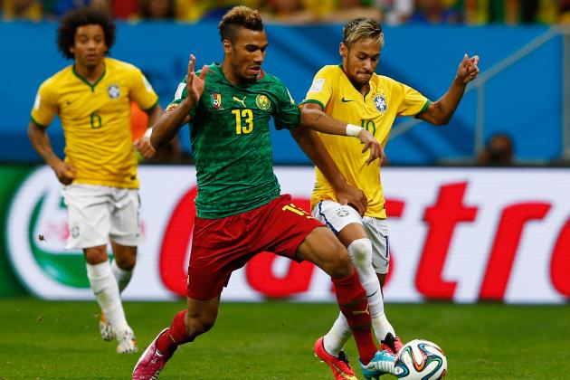 BRASILIA, BRAZIL - JUNE 23: Maxim Choupo-Moting of Cameroon battles with Neymar of Brazil during the 2014 FIFA World Cup Brazil Group A match between Cameroon and Brazil at Estadio Nacional on June 23, 2014 in Brasilia, Brazil. (Photo by Matthew Lewis/Getty Images)