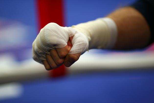 LONDON, ENGLAND - SEPTEMBER 16: George Groves gloves up during the George Groves media work out on September 16, 2014 in London, England. (Photo by Charlie Crowhurst/Getty Images)