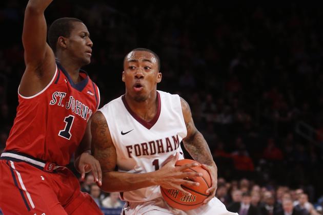 Fordham's Mandell Thomas (1) drives against St. John's Phil Greene IV (1) during the first half of an NCAA college basketball game Sunday, Dec. 14, 2014, in New York.  St. John's beat Fordham 74-53. (AP Photo/Jason DeCrow)