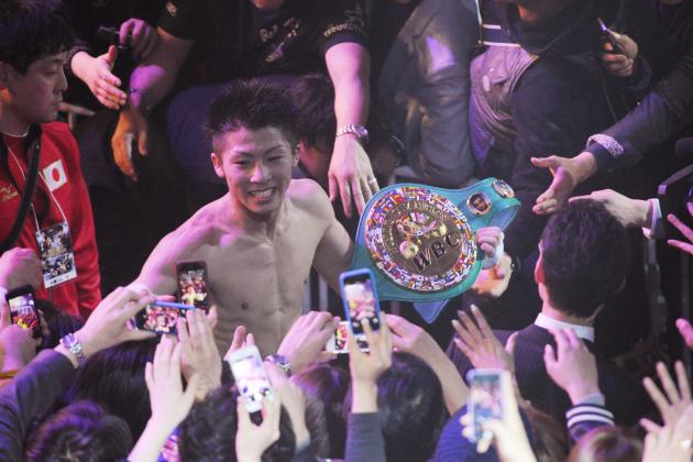 TOKYO, JAPAN - APRIL 06: New champion,Naoya Inoue celebrates the victory with fans after the WBC light flyweight title bout between Adrian Hernandez of Mexico v Naoya Inoue of Japan at Ota City General Gymnasium on April 6, 2014 in Tokyo, Japan. (Photo by Masashi Hara/Getty Images)