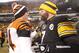 Dec 15, 2013; Pittsburgh, PA, USA; Cincinnati Bengals quarterback Andy Dalton (14) and Pittsburgh Steelers quarterback Ben Roethlisberger (7) shake hands after their game at Heinz Field. The Steelers won 30-20. Mandatory Credit: Charles LeClaire-USA TODAY Sports