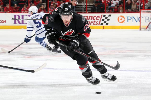 RALEIGH, NC - DECEMBER 18: Chris Terry #25 of the Carolina Hurricanes skates hard with the puck against the Toronto Maple Leafs during their NHL game at PNC Arena on December 18, 2014 in Raleigh, North Carolina.  (Photo by Gregg Forwerck/NHLI via Getty Images)