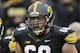 Iowa offensive lineman Brandon Scherff stands on the field during the first half of an NCAA college football game against Wisconsin, Saturday, Nov. 22, 2014, in Iowa City, Iowa. (AP Photo/Charlie Neibergall)