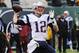 New England Patriots quarterback Tom Brady (12) throws a pass during the first half of an NFL football game against the New York Jets Sunday, Dec. 21, 2014, in East Rutherford, N.J. (AP Photo/Bill Kostroun)