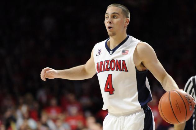 Dec 6, 2014; Tucson, AZ, USA; Arizona Wildcats guard T.J. McConnell (4) brings the ball up court during the second half against the Gonzaga Bulldogs at McKale Center. Arizona won 66-63 in overtime. Mandatory Credit: Casey Sapio-USA TODAY Sports