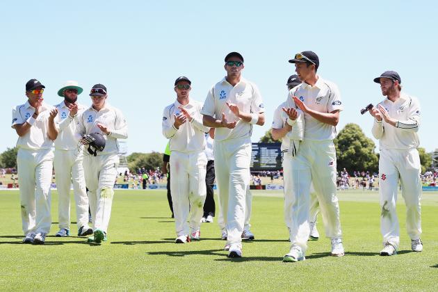 CHRISTCHURCH, NEW ZEALAND - DECEMBER 29:  Tim Southee and Trent Boult of New Zealand are acknowledged by the New Zealand team during day four of the First Test match between New Zealand and Sri Lanka at Hagley Oval on December 29, 2014 in Christchurch, New Zealand.  (Photo by Hannah Peters/Getty Images)