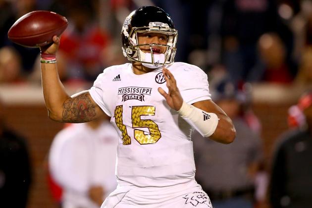 OXFORD, MS - NOVEMBER 29:  Dak Prescott #15 of the Mississippi State Bulldogs drops back to pass during their game against the Mississippi Rebels at Vaught-Hemingway Stadium on November 29, 2014 in Oxford, Mississippi.  (Photo by Streeter Lecka/Getty Images)