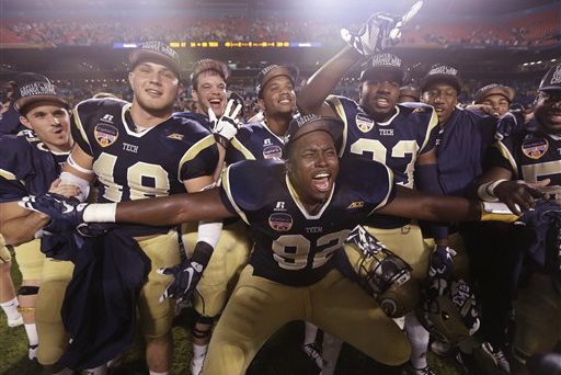 Georgia Tech defensive lineman Francis Kallon (92) celebrates with his teammates after the Orange Bowl NCAA college football game against Mississippi State, Wednesday, Dec. 31, 2014, in Miami Gardens, Fla. Georgia Tech defeated Mississippi State 49-34. (AP Photo/Lynne Sladky)