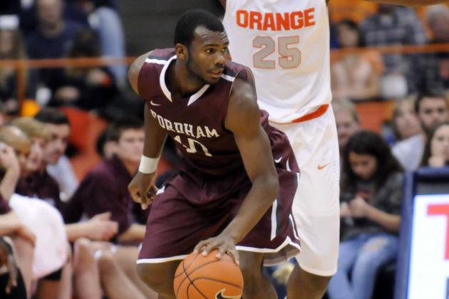 Nov 12, 2013; Syracuse, NY, USA; Fordham Rams guard Jon Severe (10) is defended by Syracuse Orange forward Rakeem Christmas (25) during the second half of a game at the Carrier Dome. Syracuse won the game 89-74. Mandatory Credit: Mark Konezny-USA TODAY Sports