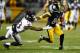 PITTSBURGH, PA - NOVEMBER 02: Antonio Brown #84 of the Pittsburgh Steelers breaks a tackle by Will Hill #33 of the Baltimore Ravens and scores a 54 yard touchdown during the fourth quarter at Heinz Field on November 2, 2014 in Pittsburgh, Pennsylvania. (Photo by Joe Sargent/Getty Images)