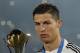 Real Madrid’s Cristiano Ronaldo poses with the trophy after winning the final soccer match between Real Madrid and San Lorenzo at the Club World Cup soccer tournament in Marrakech, Morocco, Saturday, Dec. 20, 2014. (AP Photo/Christophe Ena)