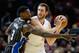Dec 3, 2014; Los Angeles, CA, USA; Los Angeles Clippers forward Spencer Hawes (10) handles the ball as Orlando Magic center Dewayne Dedmon (3) defends during the first half at Staples Center. Mandatory Credit: Richard Mackson-USA TODAY Sports