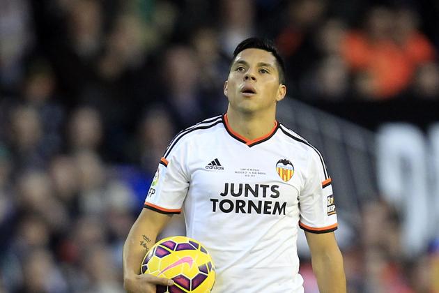Valencia's new player Enzo Perez, from Argentina, walks on the pitch during a Spanish La Liga soccer match against Real Madrid at the Mestalla stadium in Valencia, Spain, on Sunday, Jan. 4, 2015.(AP Photo/Alberto Saiz)