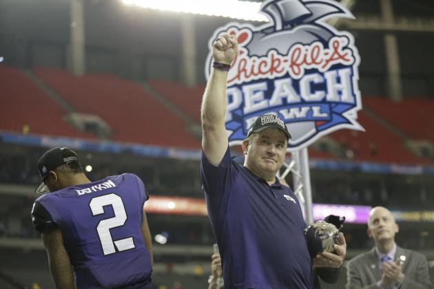 TCU head coach Gary Patterson raises a hand  after the second half of the Peach Bowl NCAA football game against Mississippi, Wednesday, Dec. 31, 2014, in Atlanta. TCU won 42-3. (AP Photo/David Goldman)