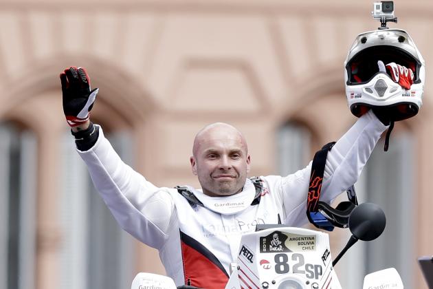 In this Sunday, Jan. 4 photo, Michal Hernik of Poland posses for a picture as he crosses the podium ramp during the symbolic start of the Dakar Rally 2015 in Buenos Aires, Argentina, 2015. According to race authorities Hernik was found dead during the third stage of the race between the cities of San Juan and Chilecito, in Argentina, Tuesday Jan. 6, 2015. (AP Photo/Natacha Pisarenko)