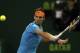 Spaniard Rafael Nadal returns the ball to Michael Berrer of Germany during the Qatar ATP Open Tennis tournament in Doha, Qatar, Tuesday, Jan. 6, 2015. (AP Photo/Osama Faisal)