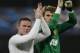 Manchester United's Wayne Rooney, left, and keeper David de Gea, right, salute supporters after their team defeated CFR Cluj in Cluj, Romania, Tuesday, Oct. 2, 2012, in an UEFA Champions League, Group H, soccer match.(AP Photo/Vadim Ghirda)