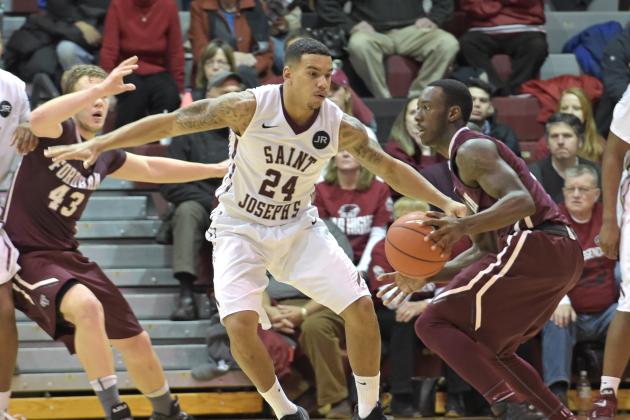 Jan 14, 2015; Philadelphia, PA, USA; Saint Joseph's Hawks guard Chris Wilson (24) defends against Fordham Rams guard Antwoine Anderson (0) during the second half at Hagan Arena. The Hawks defeated the Rams, 66-55. Mandatory Credit: Eric Hartline-USA TODAY Sports
