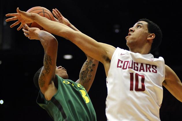 Jan 15, 2015; Pullman, WA, USA; Washington State Cougars guard Dexter Kernich-Drew (10) blocks the shot of Oregon Ducks guard Joseph Young (3) during the second half at Wallis Beasley Performing Arts Coliseum. The Cougars won 108-99 in overtime. Mandatory Credit: James Snook-USA TODAY Sports