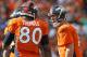 Denver Broncos quarterback Peyton Manning (18) yells to teammate Julius Thomas (80) during the second half of an NFL football game against the Kansas City Chiefs on Sunday, Sept. 14, 2014, in Denver. (AP Photo/Joe Mahoney)
